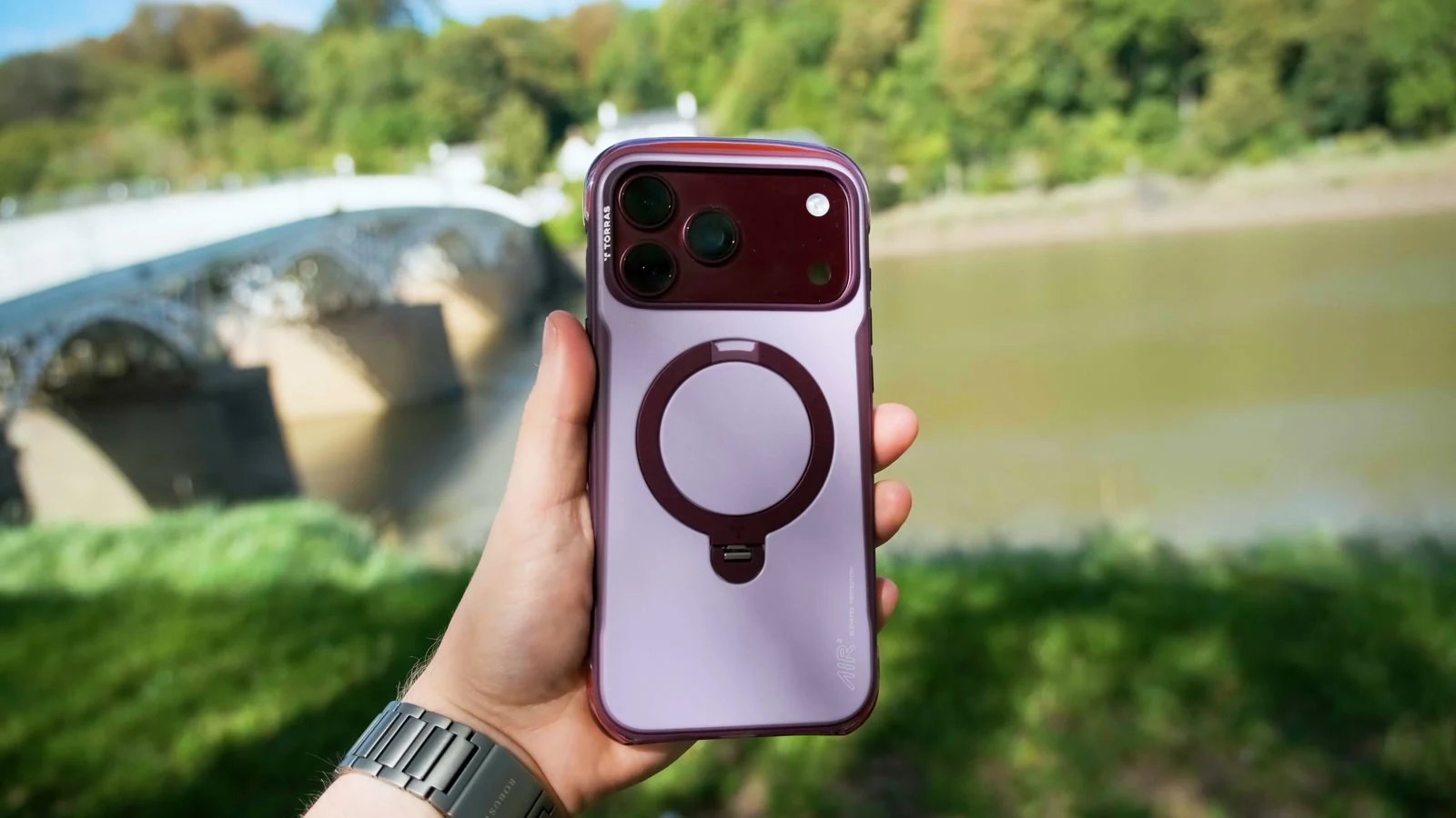 TORRAS phone case filmed outdoors, with the bridge softly behind it